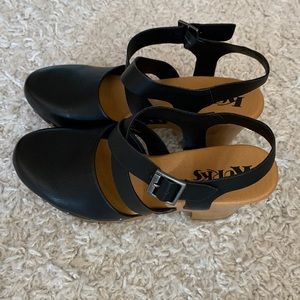 Korks Sling Back Black Clogs.